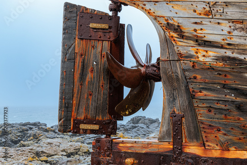 The wreck of an old fishing boat in the west of Iceland photo