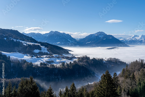 Φωτογραφία village of Furx in Vorarlberg surrounded by mountains in the snow but above the