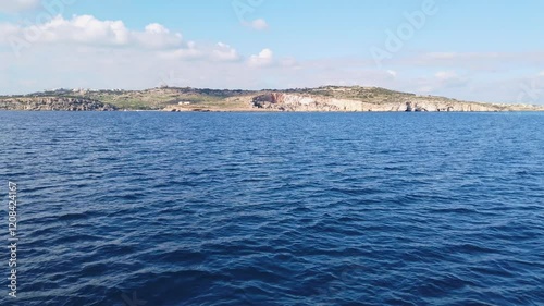 View from the prow of a ferry sailing along the eastern coast of the island of Malta on a sunny winter morning