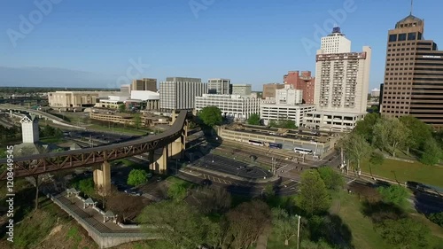 Memphis Cityscape in Tennessee. Architecture and Skyline. Mississippi River and Hernando de Soto Bridge. Trafic in Background. Drone