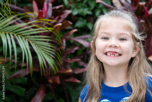 Wallpaper Mural Portrait of Cute Caucasian little preschool girl with toothless smile. Girl lost her baby tooth. Happy child. Dentistry concept. Copy space Torontodigital.ca