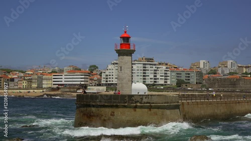 Farolim de Felgueiras lighthouse in Porto Portugal seaside. Beautiful lighthouse on the coast of Porto. Felgueiras Lighthouse, Farolim do Molhe de Felgueiras, Atlantic Ocean.  photo