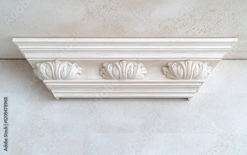 White ornate crown molding detail on ceiling photo