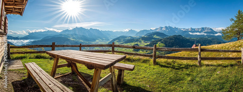 Wooden table inviting hikers to enjoy breathtaking mountain view