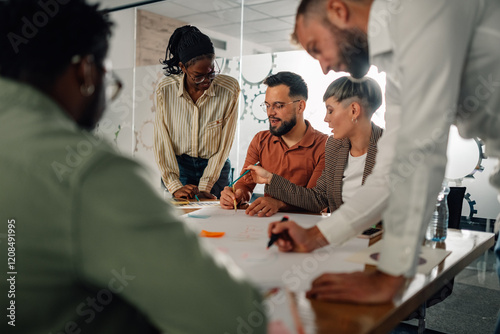 Businesspeople collaborating on project during office meeting