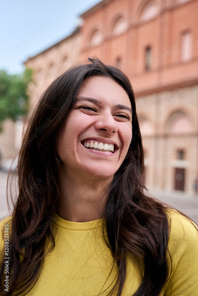 Vertical Portrait of a woman looking smiling around. Beautiful girl is happy and cute and is posing with positive expression. Attractive and confident Caucasian female enjoying outdoors Vertical Portrait of a woman looking smiling around. Beautiful girl is happy and cute and is posing with positive expression. Attractive and confident Caucasian female enjoying outdoors