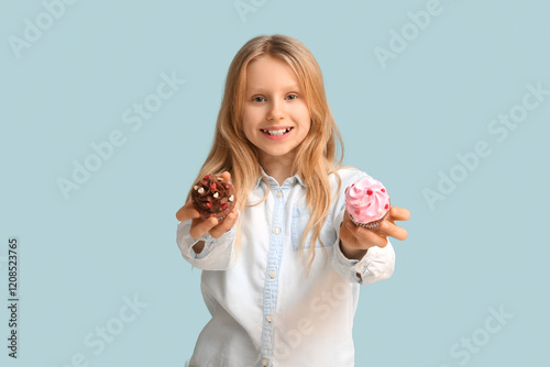 Cute little girl holding ta...
