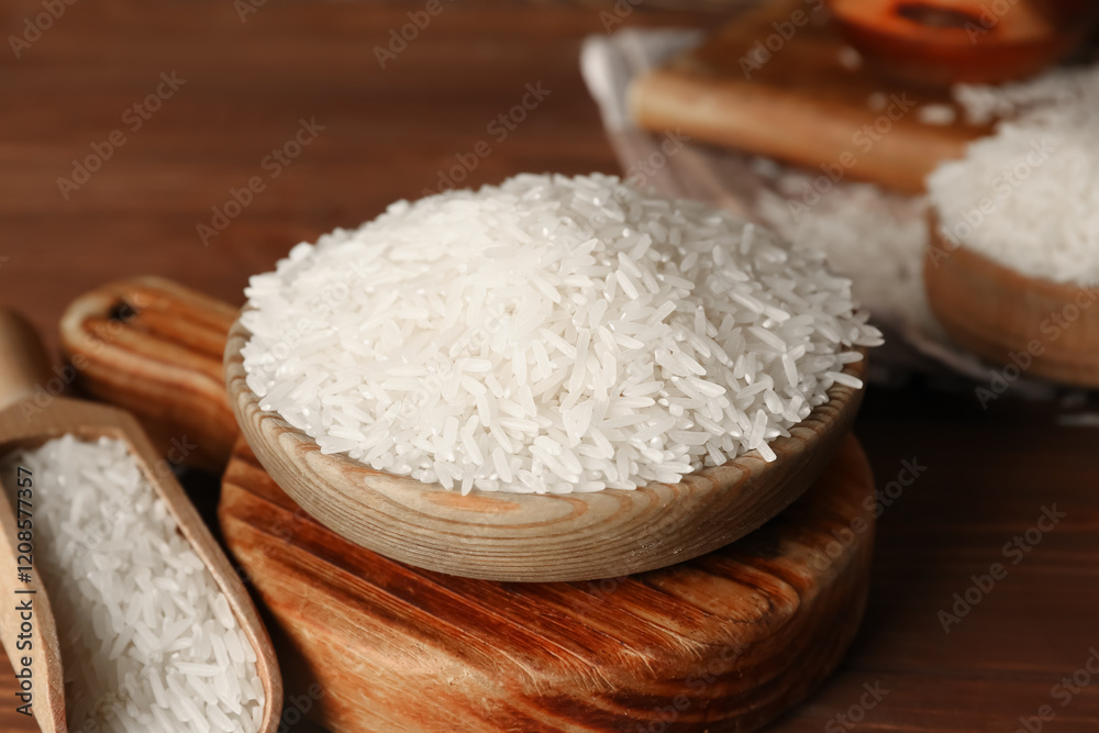 Scoop and bowl of raw rice on table. Closeup Scoop and bowl of raw rice on table. Closeup