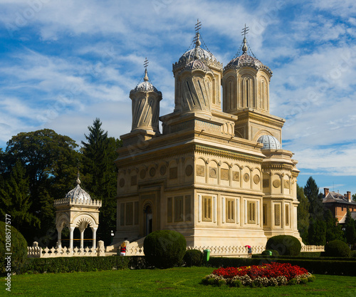 View of Romanian Orthodox Cathedral of Curtea de Arges in sunny autumn day photo