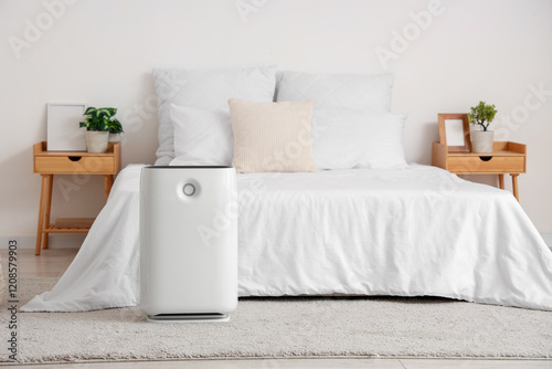 Interior of light bedroom w...