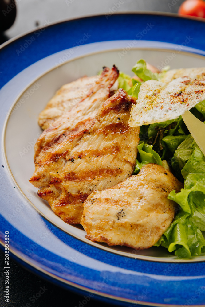 Grilled chicken salad with cheese slices, bacon, lettuce, and crispy bread for a hearty, fresh meal Grilled chicken salad with cheese slices, bacon, lettuce, and crispy bread for a hearty, fresh meal