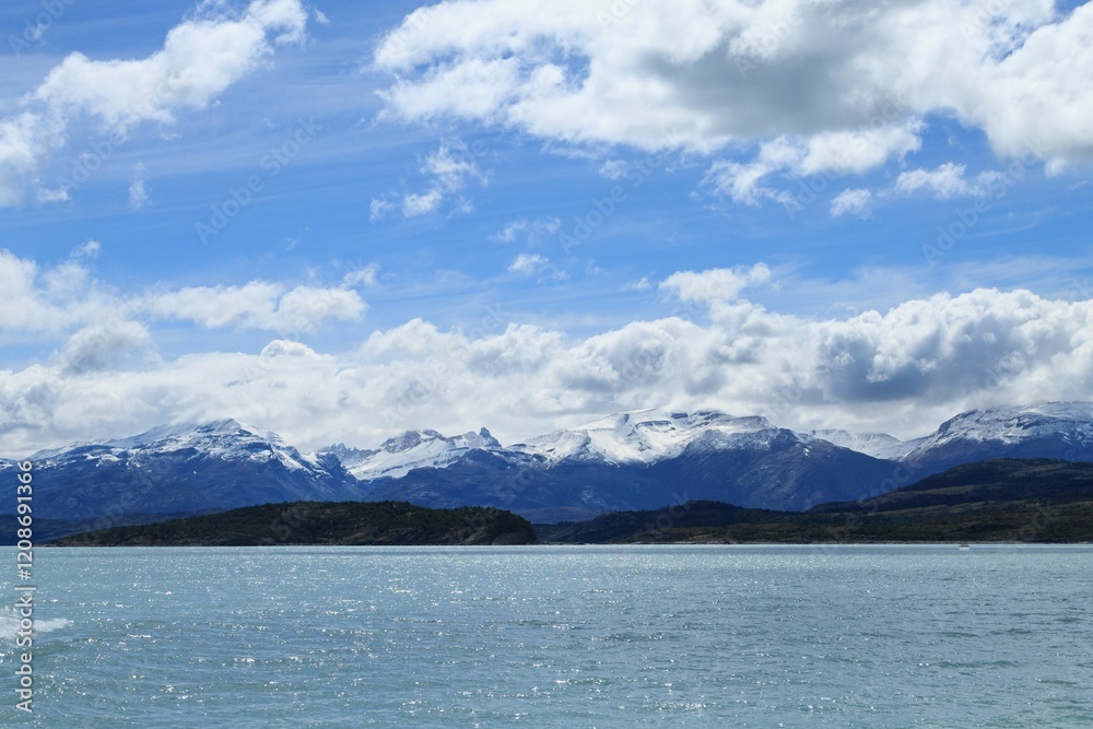 Snow-capped mountains under a bright blue sky Snow-capped mountains under a bright blue sky