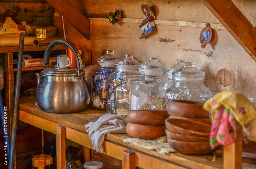 Fototapeta premium Traditional kitchen shelf with antique kettle
