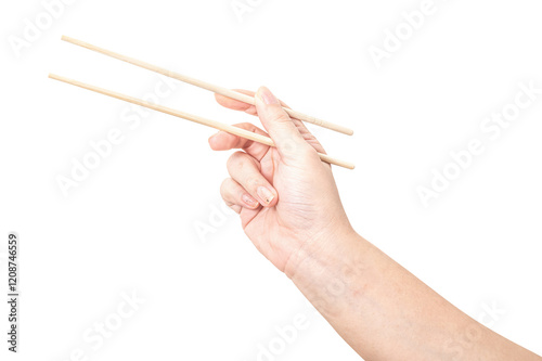 Female hand holding a wood chopstick isolated on white background.