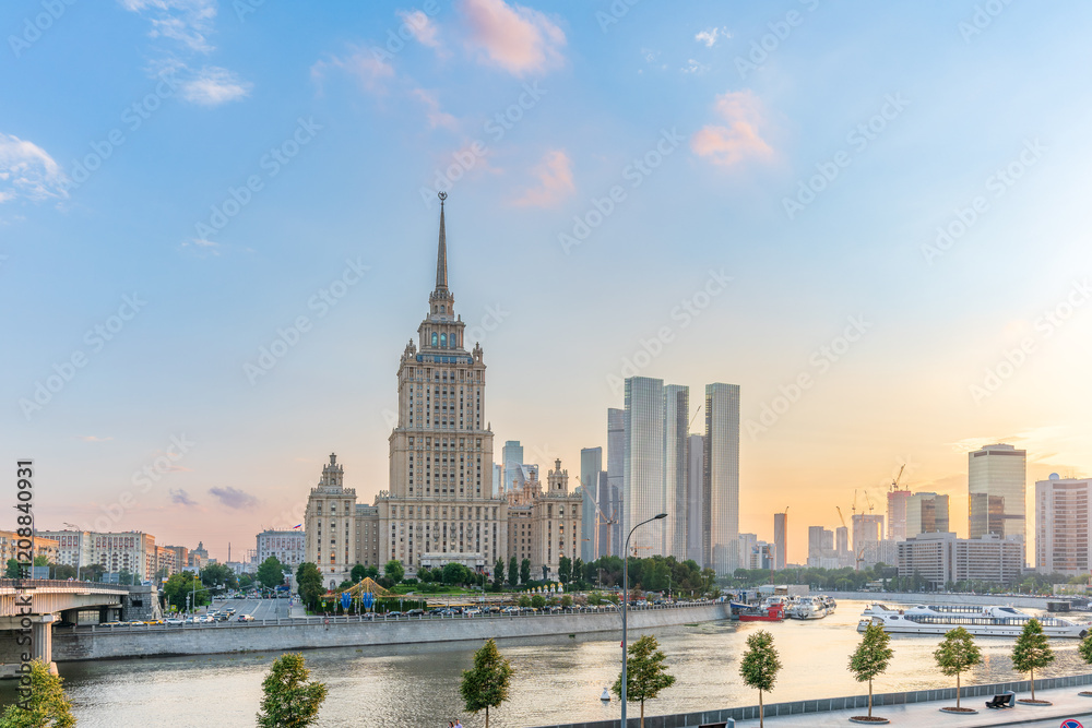 High-rise stalinist building near river at summer sunset in Moscow, Russia. Historic name is Hotel Ukraine. High-rise stalinist building near river at summer sunset in Moscow, Russia. Historic name is Hotel Ukraine.