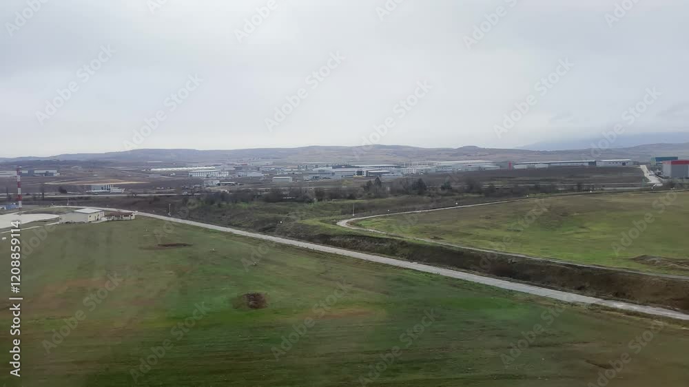 Passenger pov from plane landing on wet slippery runway on Skopje airport in Macedonia Passenger pov from plane landing on wet slippery runway on Skopje airport in Macedonia