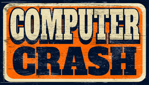 Aged and worn computer crash sign on wood