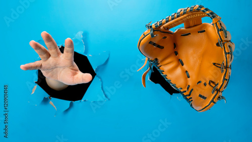 Photography Human hand wearing softball or baseball gloves through ripped paper