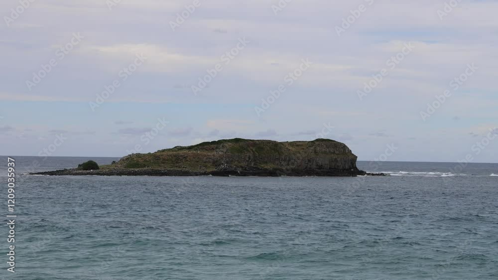 Island in Calm Ocean Waters Island in Calm Ocean Waters