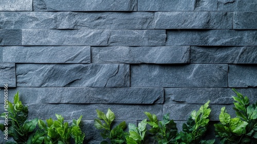 A detailed close-up of a textured stone wall featuring a vibrant planter positioned at its base, highlighting the contrast between materials. photo