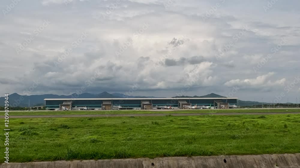 An airport on the outskirts of a small town with several planes preparing to take off. An airport on the outskirts of a small town with several planes preparing to take off.