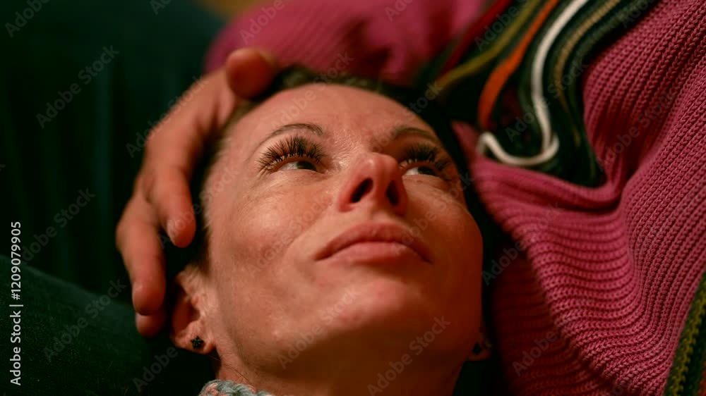 A woman with delicate features looks up, her expression is gentle. The man looks at her with warmth, creating an atmosphere of care and affection. A woman with delicate features looks up, her expression is gentle. The man looks at her with warmth, creating an atmosphere of care and affection.
