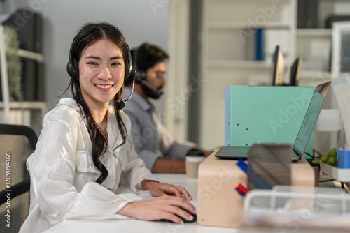 Portrait of Asian businesswoman call center work in office corporate. 