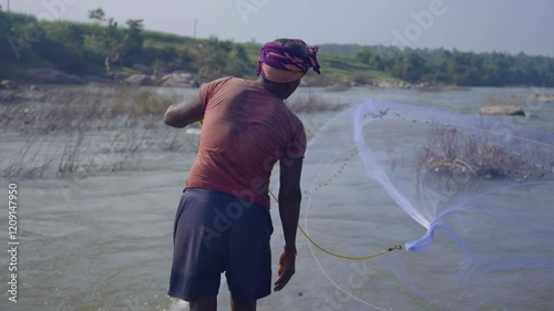 Fishing in the river offers tranquility, patience, and a chance to connect with nature while catching fish in flowing waters.  Unknown people or module. 01st Jan 2025