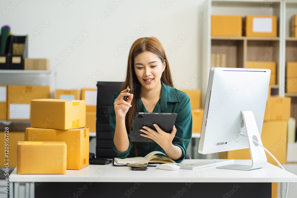 Concept of selling products online.entrepreneur or freelance checking orders from customers, woman runs an e-commerce business on websites and social media. Concept of selling products online.entrepreneur or freelance checking orders from customers, woman runs an e-commerce business on websites and social media.