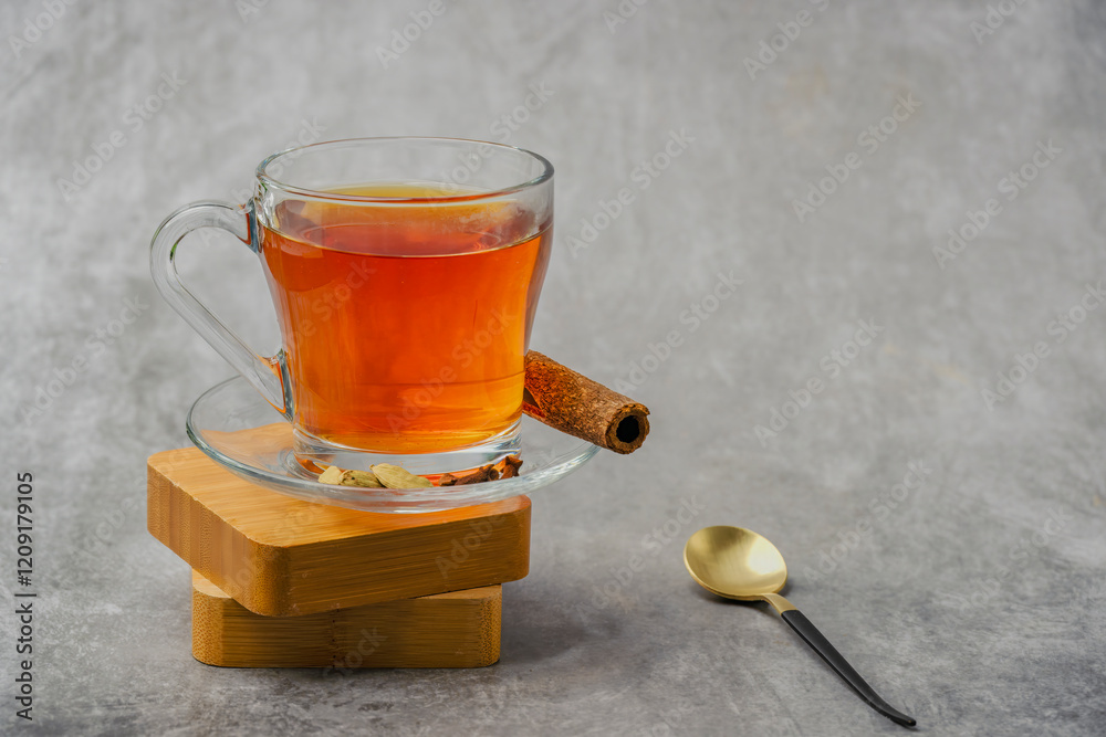 Black tea in a glass cup also locally called kattan chai, Sulaimani tea, Kerala Kattan Chaya, Malabar spiced tea.