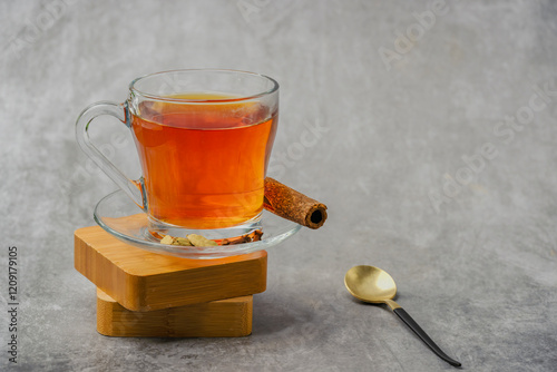 Obraz na płótnie Black tea in a glass cup also locally called kattan chai, Sulaimani tea, Kerala Kattan Chaya, Malabar spiced tea. w salonie