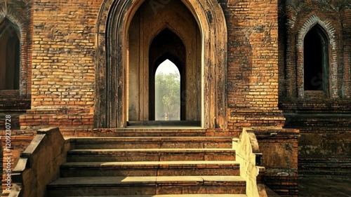 Exploring ancient architecture at a historic site with patterned bricks and intricate arches during golden hour