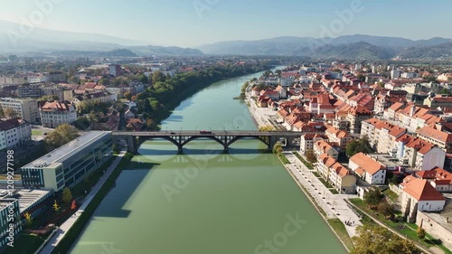 Amazing panoramic video of Maribor old town with bridges and beautiful red roofed houses along Drava river in Slovenia