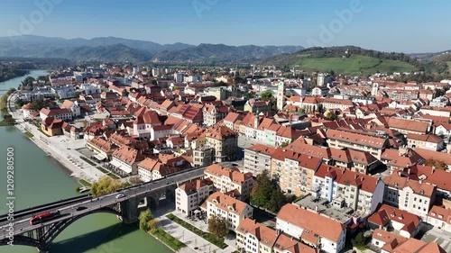 Amazing panoramic video of Maribor old town with bridges and beautiful red roofed houses along Drava river in Slovenia