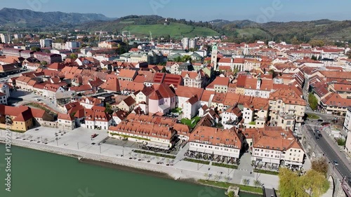 Amazing panoramic video of Maribor old town with bridges and beautiful red roofed houses along Drava river in Slovenia