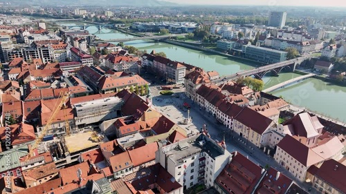 Amazing panoramic video of Maribor old town with bridges and beautiful red roofed houses along Drava river in Slovenia
