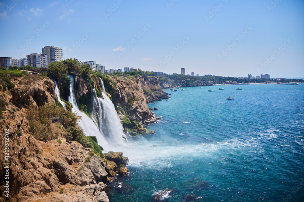 Waterfall in Antalya, Turkey. It falls into the Mediterranean Sea. Sights of the city and region Waterfall in Antalya, Turkey. It falls into the Mediterranean Sea. Sights of the city and region