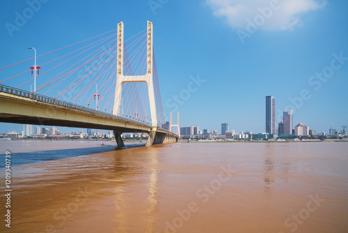 The urban skyline, Bayi Bridge, and Ganjiang River scenery of Nanchang City, Jiangxi Province, China on April 1, 2024 photo