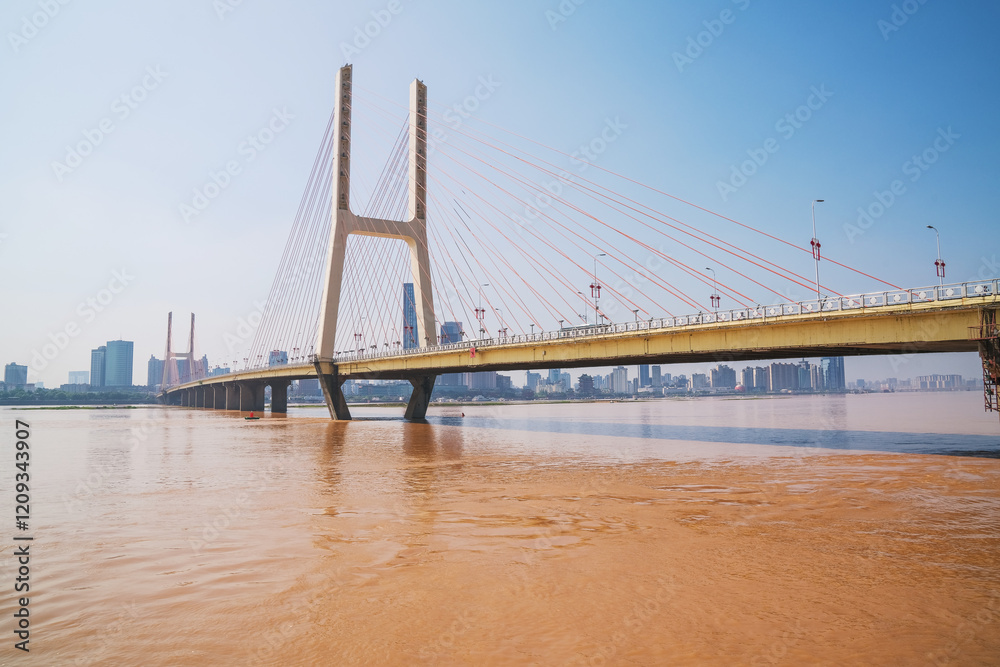 Obraz premium The urban skyline, Bayi Bridge, and Ganjiang River scenery of Nanchang City, Jiangxi Province, China on April 1, 2024