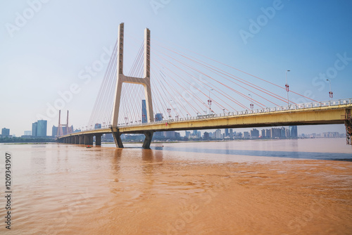 The urban skyline, Bayi Bridge, and Ganjiang River scenery of Nanchang City, Jiangxi Province, China on April 1, 2024 photo