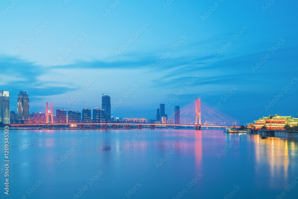 The urban skyline, Bayi Bridge, and Ganjiang River scenery of Nanchang City, Jiangxi Province, China on April 1, 2024 The urban skyline, Bayi Bridge, and Ganjiang River scenery of Nanchang City, Jiangxi Province, China on April 1, 2024