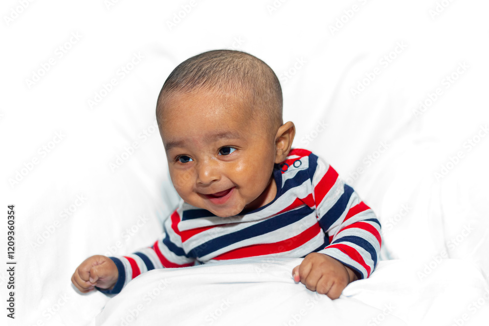 Portrait of a three-month-old baby wearing a red, blue, and white striped shirt and sitting on an isolated white background. Portrait of a three-month-old baby wearing a red, blue, and white striped shirt and sitting on an isolated white background.