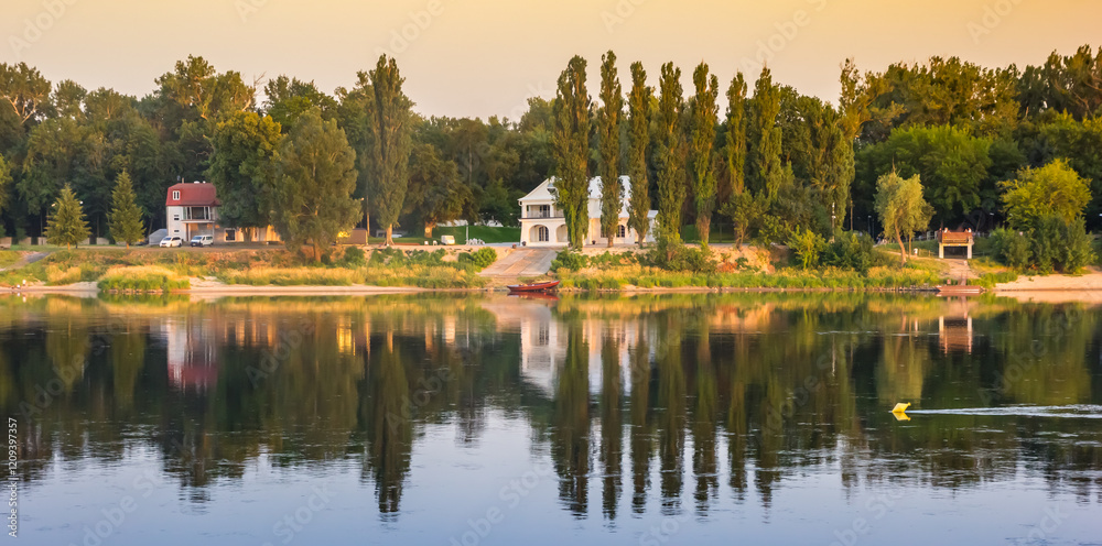 Houses and trees at the Wisla river in Torun, Poland