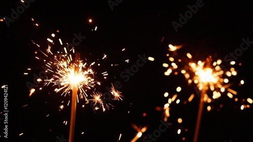 Celebrate joyfully with dazzling sparkler lights at a nighttime gathering under the stars