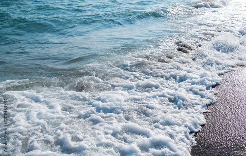 Fototapeta Naklejka Na Ścianę i Meble -  Soft wave of blue sea on sandy beach.