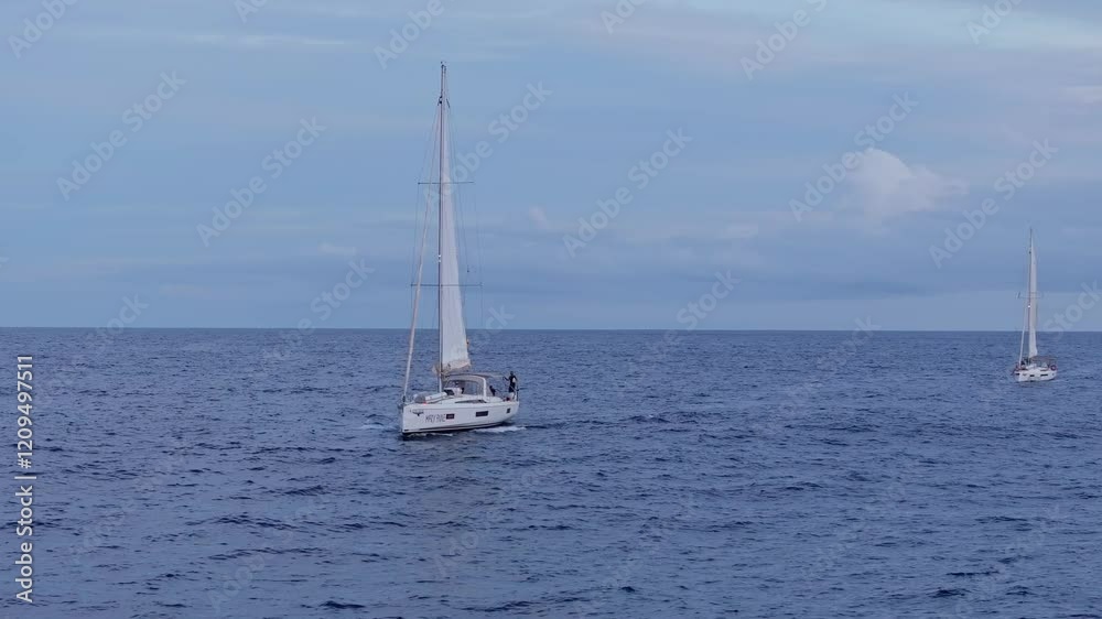 Drone moves around yachts in the Atlantic Ocean, serenity and maritime adventure Drone moves around yachts in the Atlantic Ocean, serenity and maritime adventure