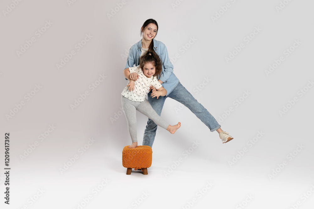 Full length portrait of cute sisters on white background Full length portrait of cute sisters on white background