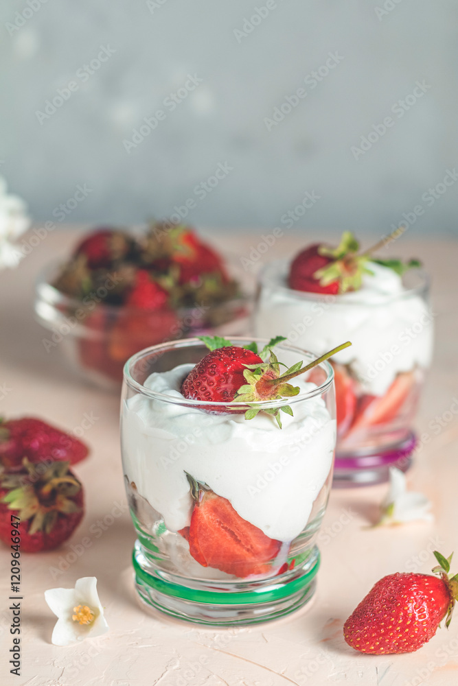 Delicious strawberries with cream cheese dessert in glasses Delicious strawberries with cream cheese dessert in glasses