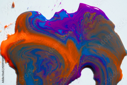 Abstract vibrant multi-color wet paint drops, swirl and splotch on white background. Purple orange and pink neon colors photo