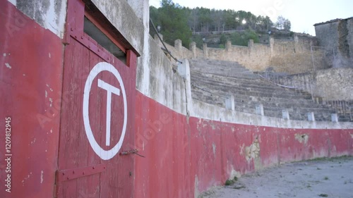 Wide view of the toril gate and abandoned bullring in Rubielos de Mora